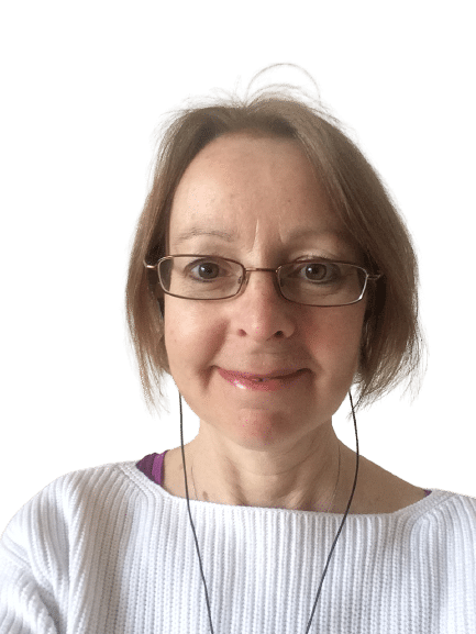 Profile photo of Denise, an older white woman with short blonde hear and glasses. She is wearing a white jumper and is smiling at the camera.