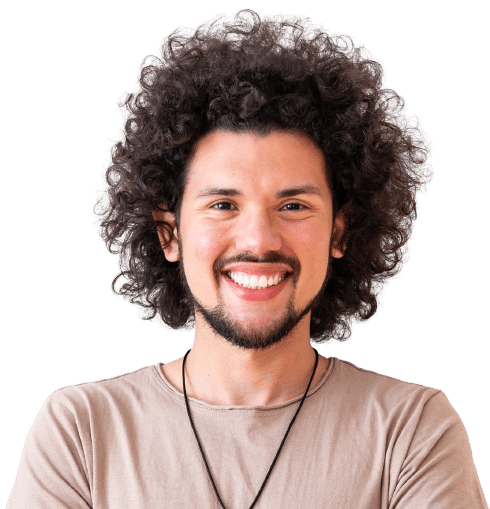 A Latin American man with long curly hair, mustache and beard smiling and wearing a light brown shirt before white background